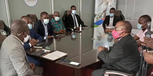 Deputy Transport Minister for Administration & Insurance, Honorable Sirleaf R. Tyler (right) and Leadership of the Liberia Insurance Association.